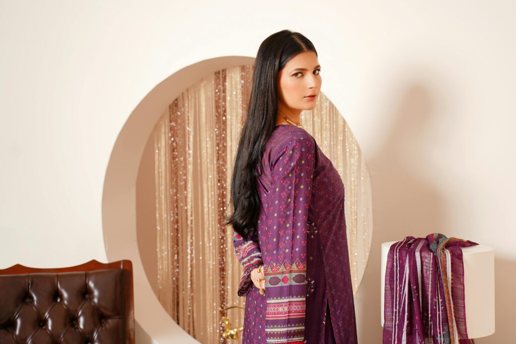 Portrait of a young woman in traditional Pakistani attire indoors in Lahore.